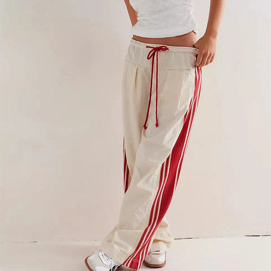 Track pants with side stripes and elasticated waist