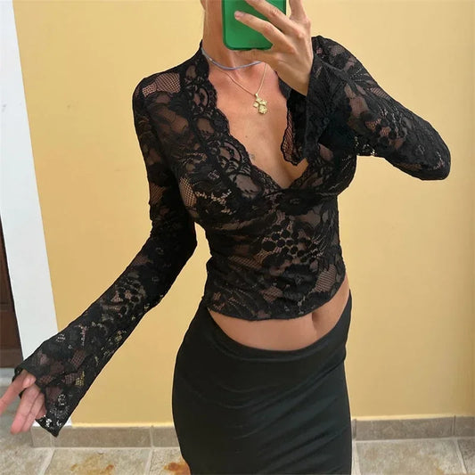Lace top with a plunging V-neck and long sleeves